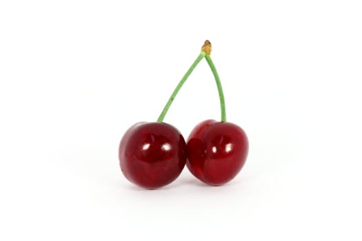Two sweet cherries isolated on white background