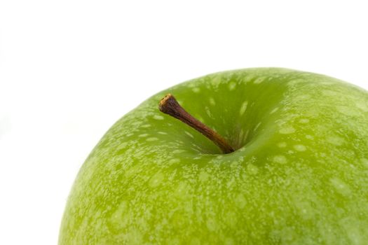 detail of a granny smith apple isolated on white background