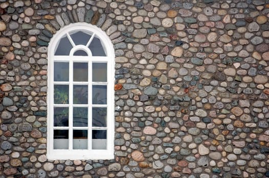 Picture of a window on a stone wall