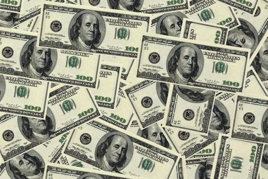 Background image of many one hundred dollar bills.