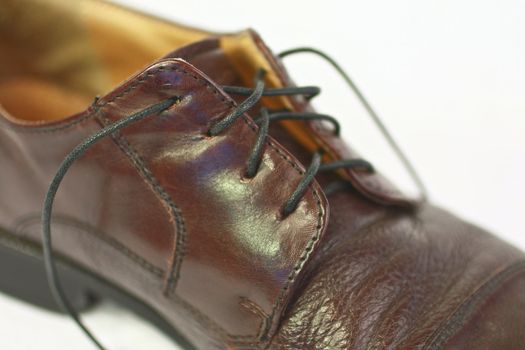 Mens brown shoe with black shoe string