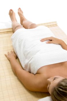 portrait of laying blonde female on an isolated white background