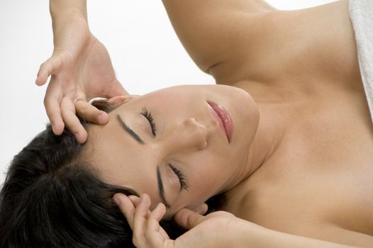 female suffering from headache on an isolated white background