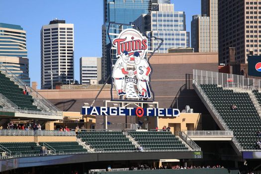 Classic Twins logo installed at new outdoor stadium, with Minneapolis skyscrapers in background