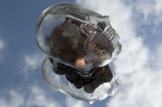 a glass piggy bank floating in the sky with a reflection