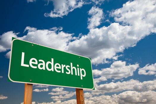 Leadership Green Road Sign with Copy Room Over The Dramatic Clouds and Sky.