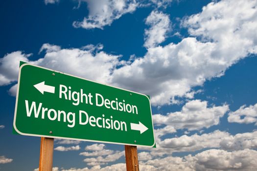 Right Decision, Wrong Decision Green Road Sign with Copy Room Over The Dramatic Clouds and Sky.