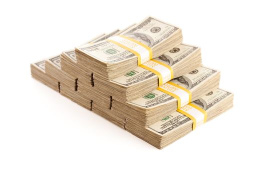 Stacks of Ten Thousand Dollar Piles of One Hundred Dollar Bills Isolated on a White Background.