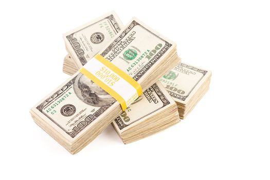Stacks of Ten Thousand Dollar Piles of One Hundred Dollar Bills Isolated on a White Background.