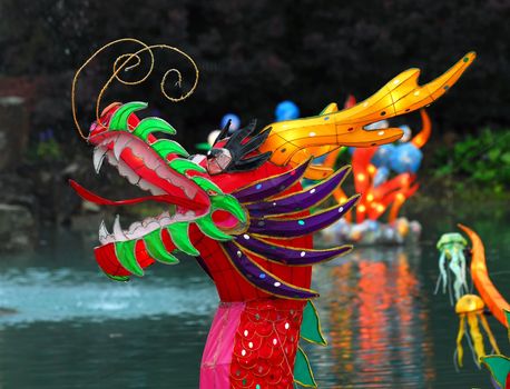 Portrait of an Illuminated Chinese Dragon on a lake