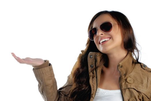 Girl holding product with smile isolated on white