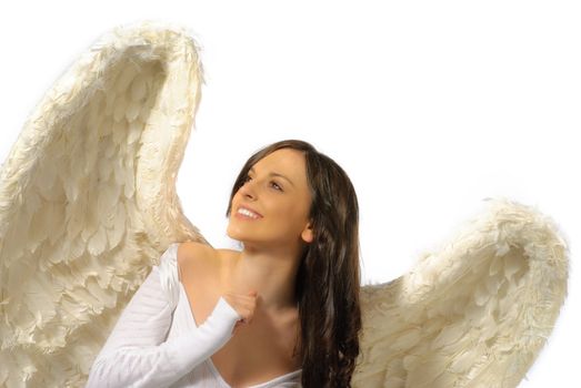 Young woman wearing angel wings with smile looking up