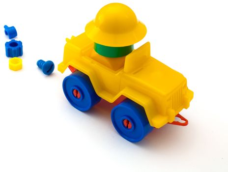Yellow toy machine on the white background