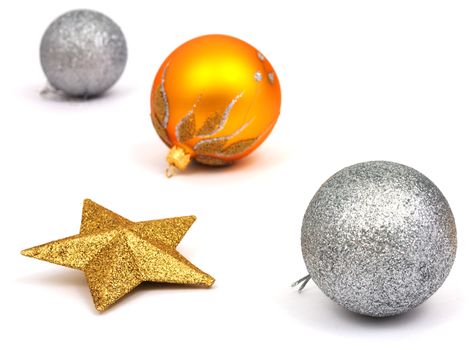 Four New-Year tree decorations on a white background