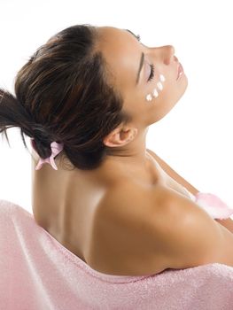 brunette dressing pink towel and relaxing herself