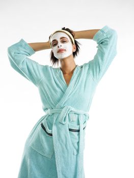 cute and nice girl with face cream mask and posing