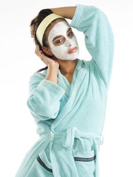 cute and nice girl with face cream mask and posing