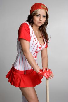 Beautiful girl wearing baseball uniform