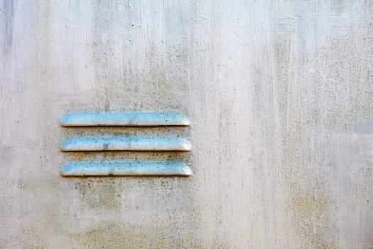 Ventilating lattice on an old metal surface - background