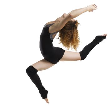 a modern dancer with black dress jumping