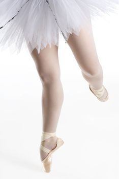 dancer in a white tutu on a white background