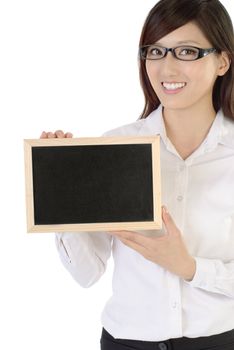 Businesswoman holding blackboard with smiling face on white background.