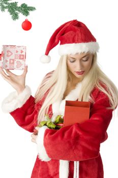 close up of a blond santa clause looking inside a gift box