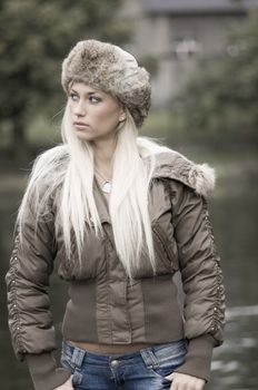 outdoor portrait of a young woman in winter dress