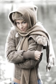 outdoor portrait of a young woman shaking like a leaf for the cold winter
