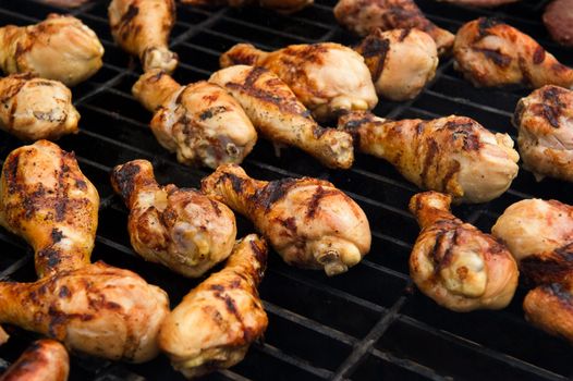 Image of chicken cooking on a grill