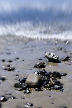 rocks on a beach in the the summer time