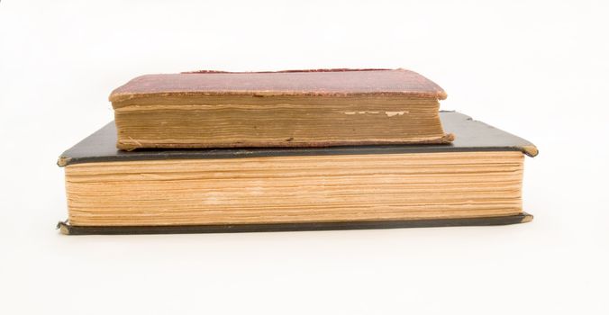 Stack of old books, isolated on white.