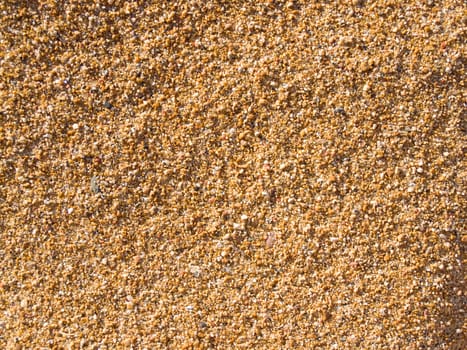 From a lake shore, texture of many colored sand.