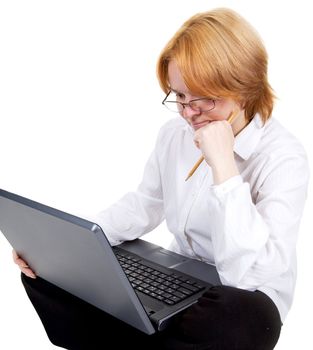 The girl working on the black laptop on a white background