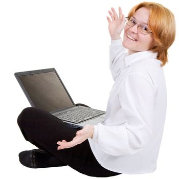 The woman sitting on a floor with the laptop on white