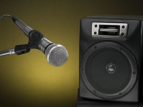 Professional microphone and speaker with a defused yellow background.