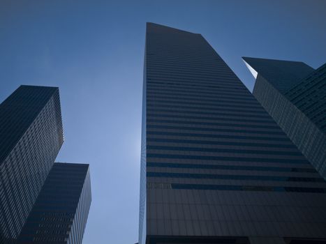 High modern skyscrapers on a background of a blue sky.