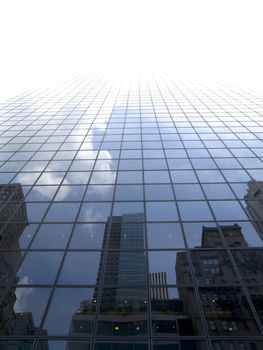 High modern skyscraper on a background of a bright sky.