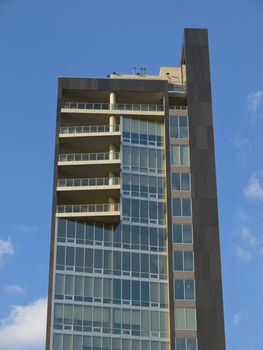 Modern west side loft building on blue sky background.