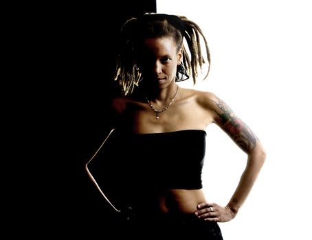 African American woman with dreadlocks against black and white wall