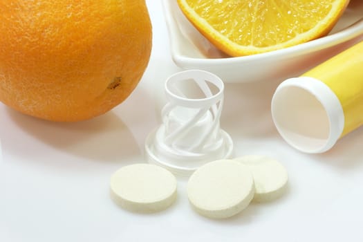 Effervescent tablets with plastic container on yellow background