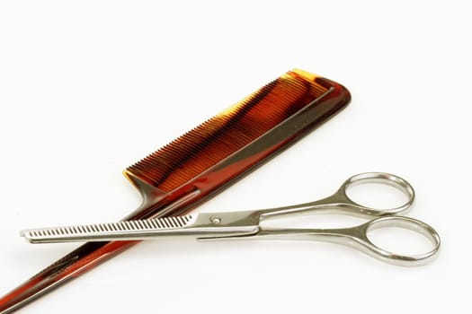 Haircutting tools on bright background