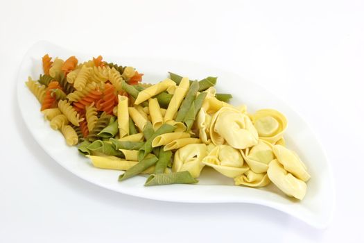 Raw pasta on bright background. Shot in Studio.