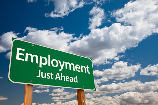 Employment, Just Ahead Green Road Sign with Copy Room Over The Dramatic Clouds and Sky.