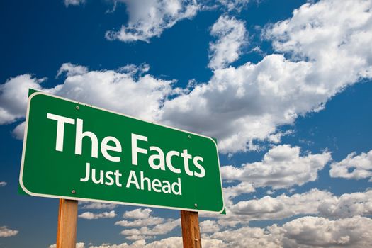 The Facts, Just Ahead Green Road Sign with Copy Room Over The Dramatic Clouds and Sky.