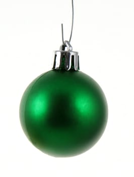 A single isolated green Christmas bauble hanging.
