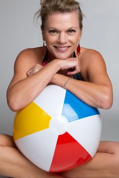 Woman holding beach ball