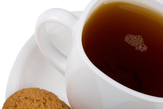 close-up cup of tea and cookie, isolated on white