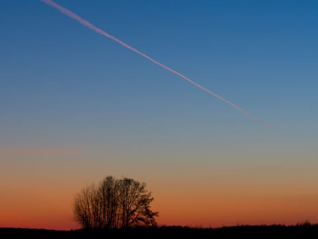 evening landscape, airplane on sunset sky