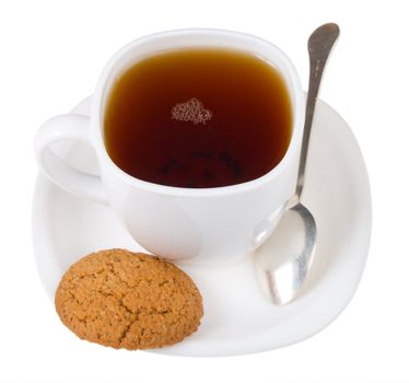 tea and spoon with cookie, isolated on white